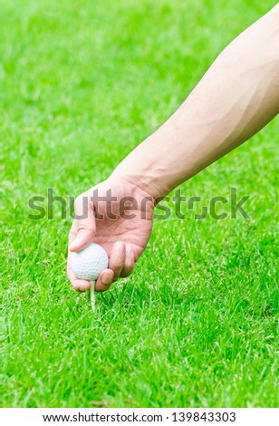 golfer set up a tee
