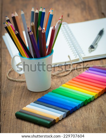color pencils in white cup