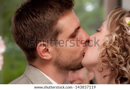 Happy just married couple kissing