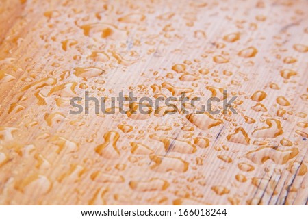 Water drops on the wooden table after the rain