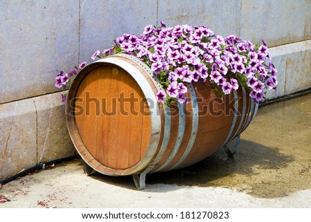 Old wine barrel decorated with flowers