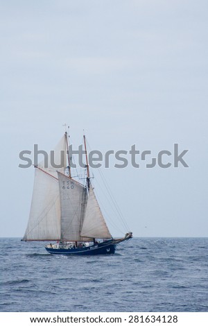 RIGA, LATVIA - JULY 25, 2013: Regatta The Tall Ships Races. Sailing ship come from the sea into the river Daugava
