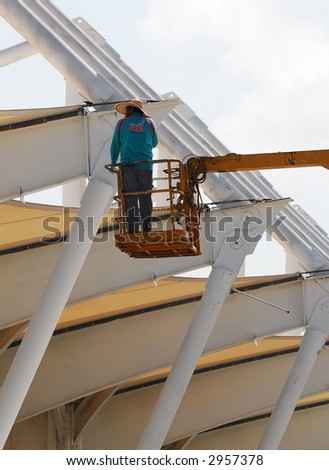 Worker at works during Formula One test session at Sepang International Circuit