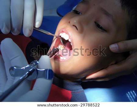 A boy expressions when the needle in his mouth