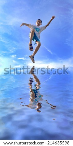 boy jumps to the ocean with reflection effects.