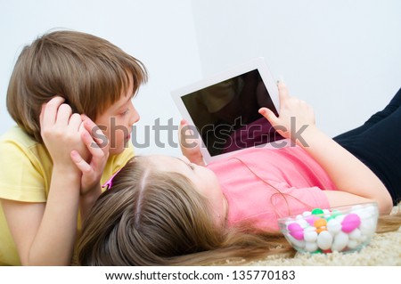 children watching tablet PC computer children watching tablet PC computer