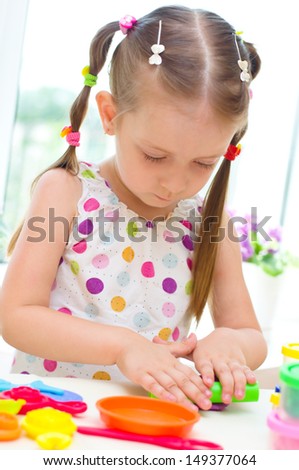 Little Girl Playing with Color Play Dough