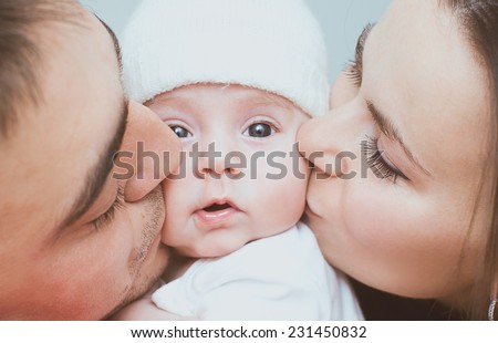Young mother and father with newborn