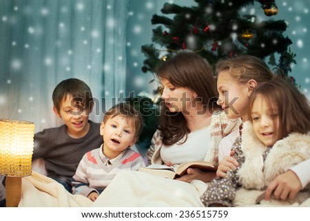 Happy Mother Reading Bible Story to her children