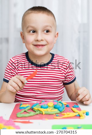 Little Boy Playing with Color Play Dough