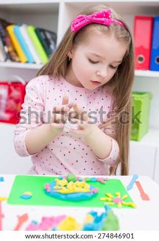 Little Girl Playing with Color Play Dough