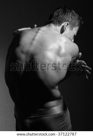 Muscled male model in black and white