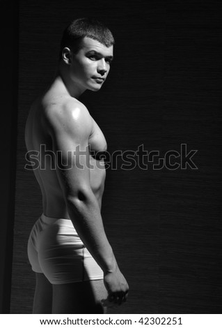 Muscle handsome young male model in studio