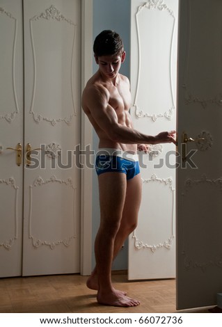 Male model posing at the doors