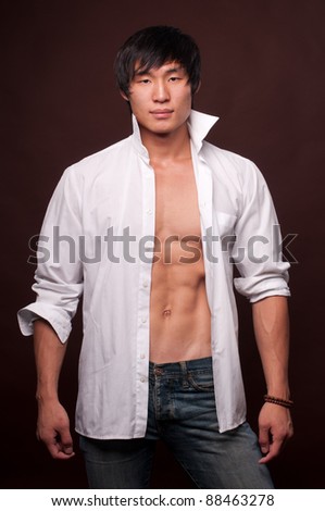 Muscled Korean model in whirte shirt