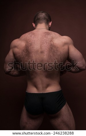 Muscled male model with body hair