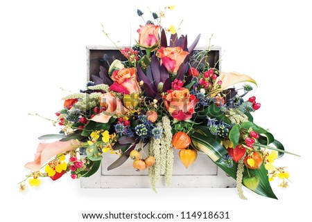 colorful floral arrangement of roses, lilies, freesia, orchids and irises isolated on white background