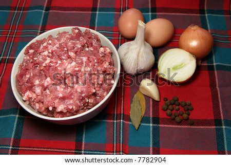 Ground meat and onion, garlic, eggs and spices.