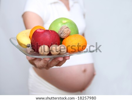 ... Woman Holding Fruits. Nine Month. Third Trimester Stock Photo