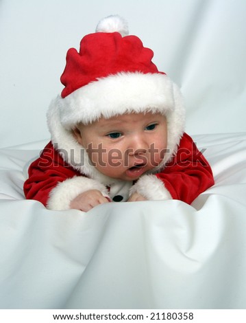 stock-photo-newborn-baby-dressed-in-santa-claus-costume-21180358.jpg