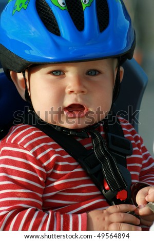 best bike helmets for babies on Happy baby in bicycle chair. 10 months old baby boy in helmet. - stock ...