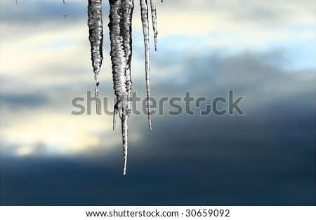 Frozen icicles against an ominous sky.