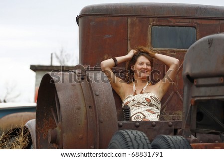 A Young Woman Posing in the Bed of an Antique Truck