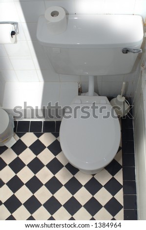 black and white tiled bathroom. tiled in lack and white