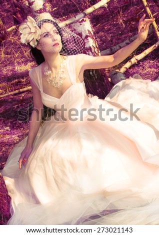Beautiful brunette bride portrait in summer baroque background with sky in wedding day