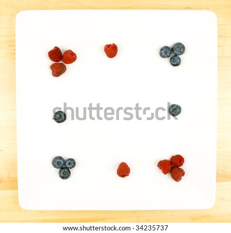 Fruit Plate with raspberries, blue berries and copy space