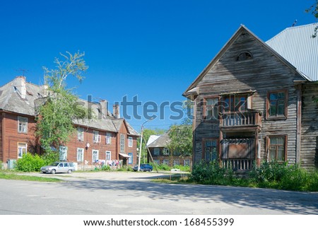 Wooden apartment houses in Segezha town in July. Karelia region, Russia