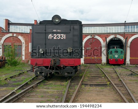 MOSCOW - MAY 17 2014: L-2331 steam locomotive and diesel locomotive at depot of old railway station Podmoskovnaya.