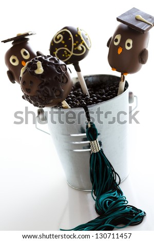 Gourmet chocolate cake pops decorated for graduation party.