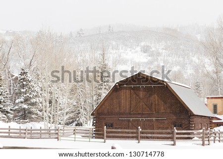 A new barn in winter landscape.