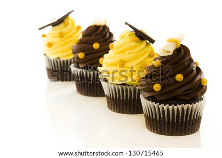Gourmet chocolate cupcakes decorated for graduation party.