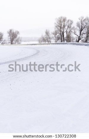 Road covered in snow after winter storm.