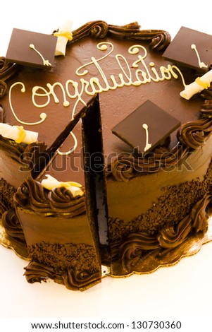Gourmet chocolate cake decorated for graduation party.