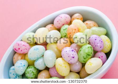 Assorted jelly beans in pastel colors with darker spots.