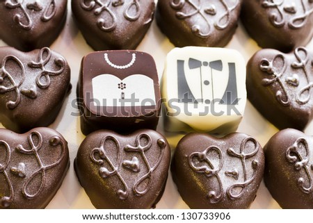 Small chocolates decorated for the wedding party.