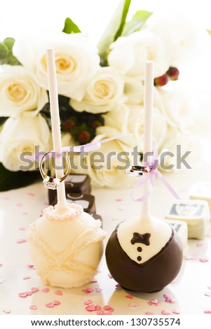 Chocolate cake pops decorated for the wedding party.