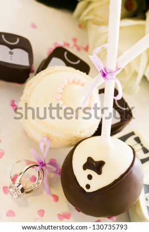 Chocolate cake pops decorated for the wedding party.