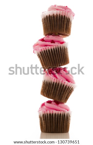 Stack of pink cupcakes on white background.