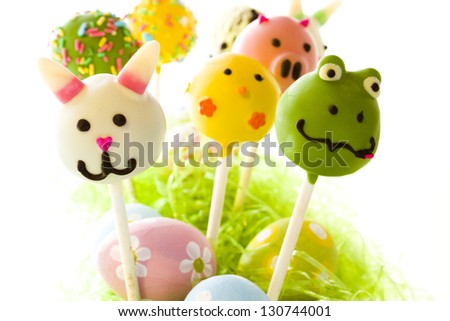 Dark chocolate Easter cake pops decorates with faces of different animals.