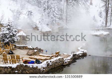 Strawberry Hot Springs surrounded by winter forest.