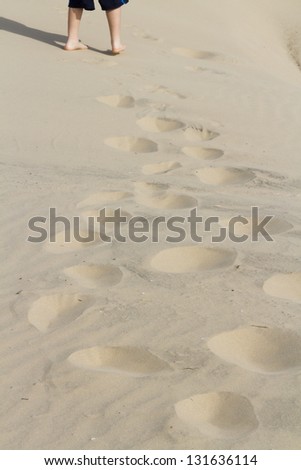 Footprints in sand of coastal dunes.