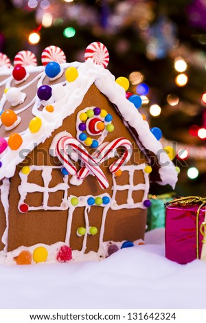 Gingerbread house with small presents.