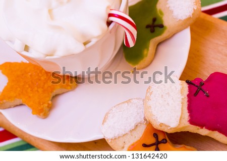 Colorful Christmas sugar cookies with hot chocolate.