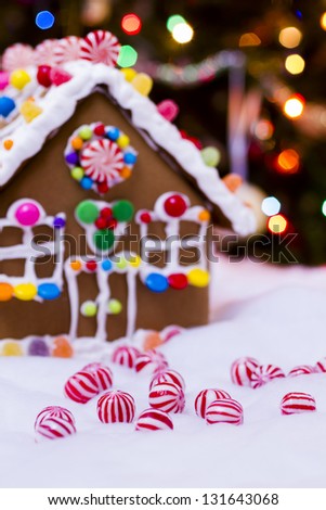 Gingerbread house with round  peppermint candies.