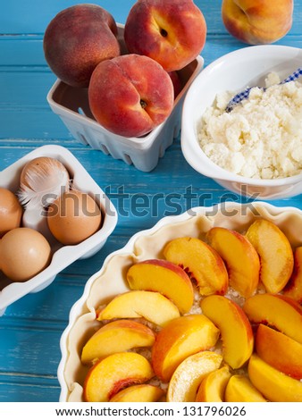 Homemade peach pie in white dish.