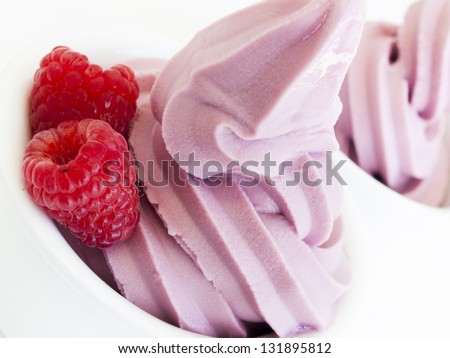 Frozen soft-serve yogurt in cup on white background.